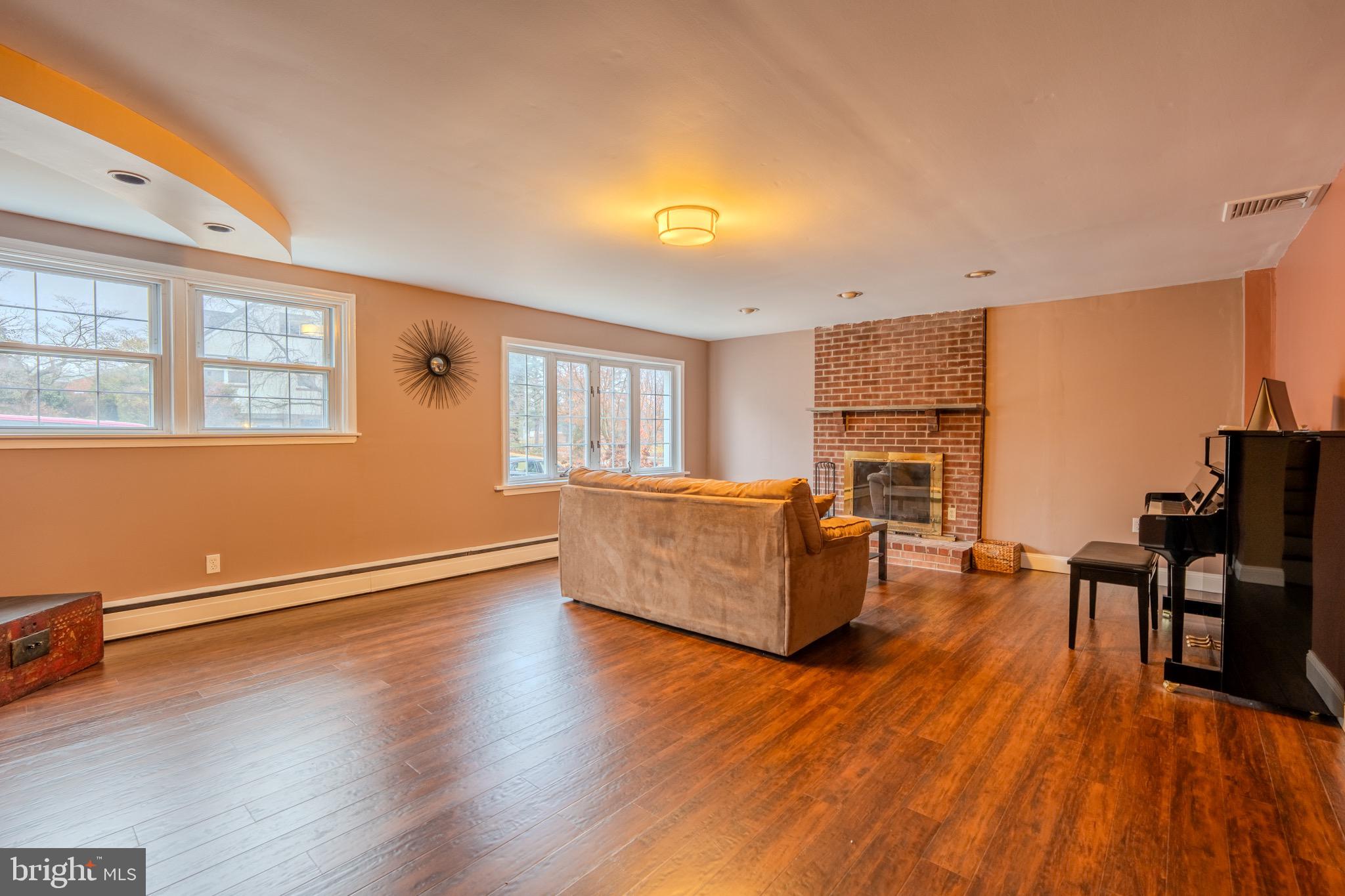 613 Seville Street Philadelphia, PA 19128 - Photo 16 of 37 a living room with furniture and a wooden floor