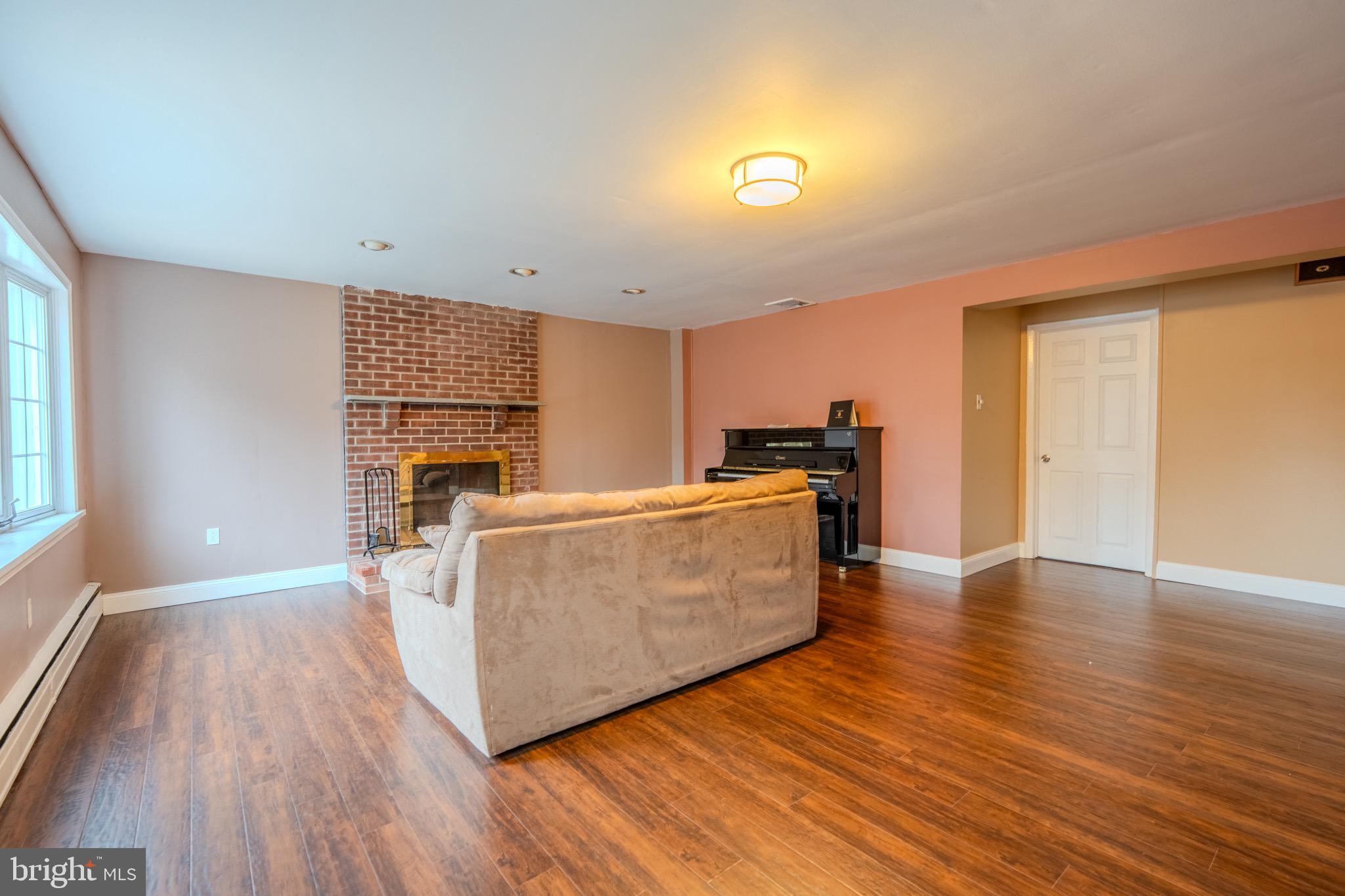 613 Seville Street Philadelphia, PA 19128 - Photo 17 of 37 a living room with furniture and a wooden floor