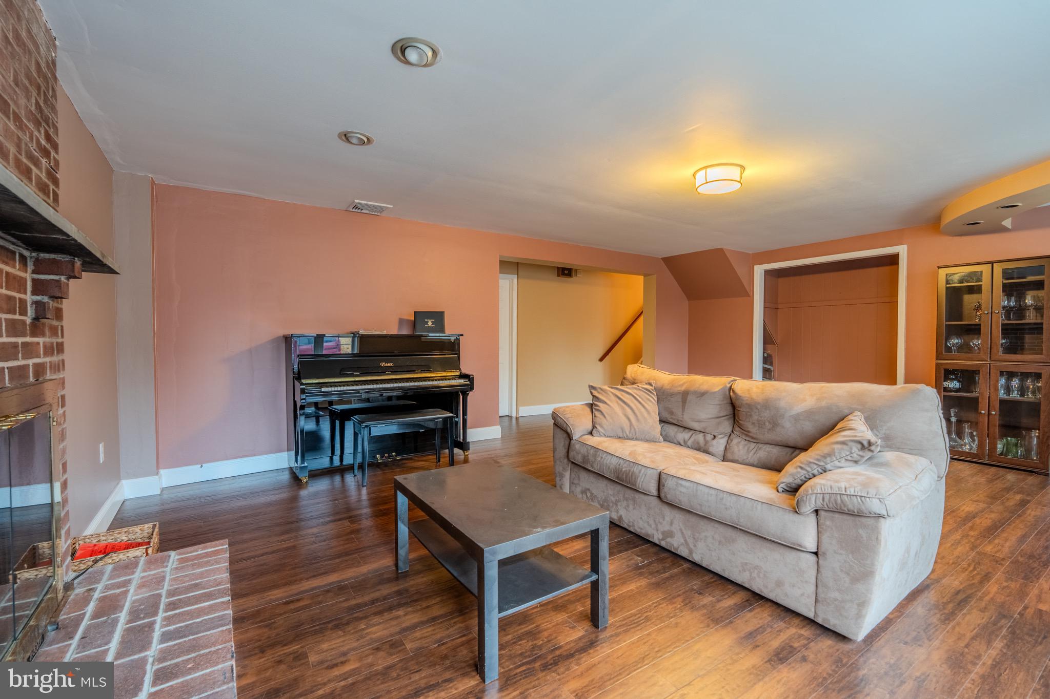 613 Seville Street Philadelphia, PA 19128 - Photo 18 of 37 a living room with furniture and a piano