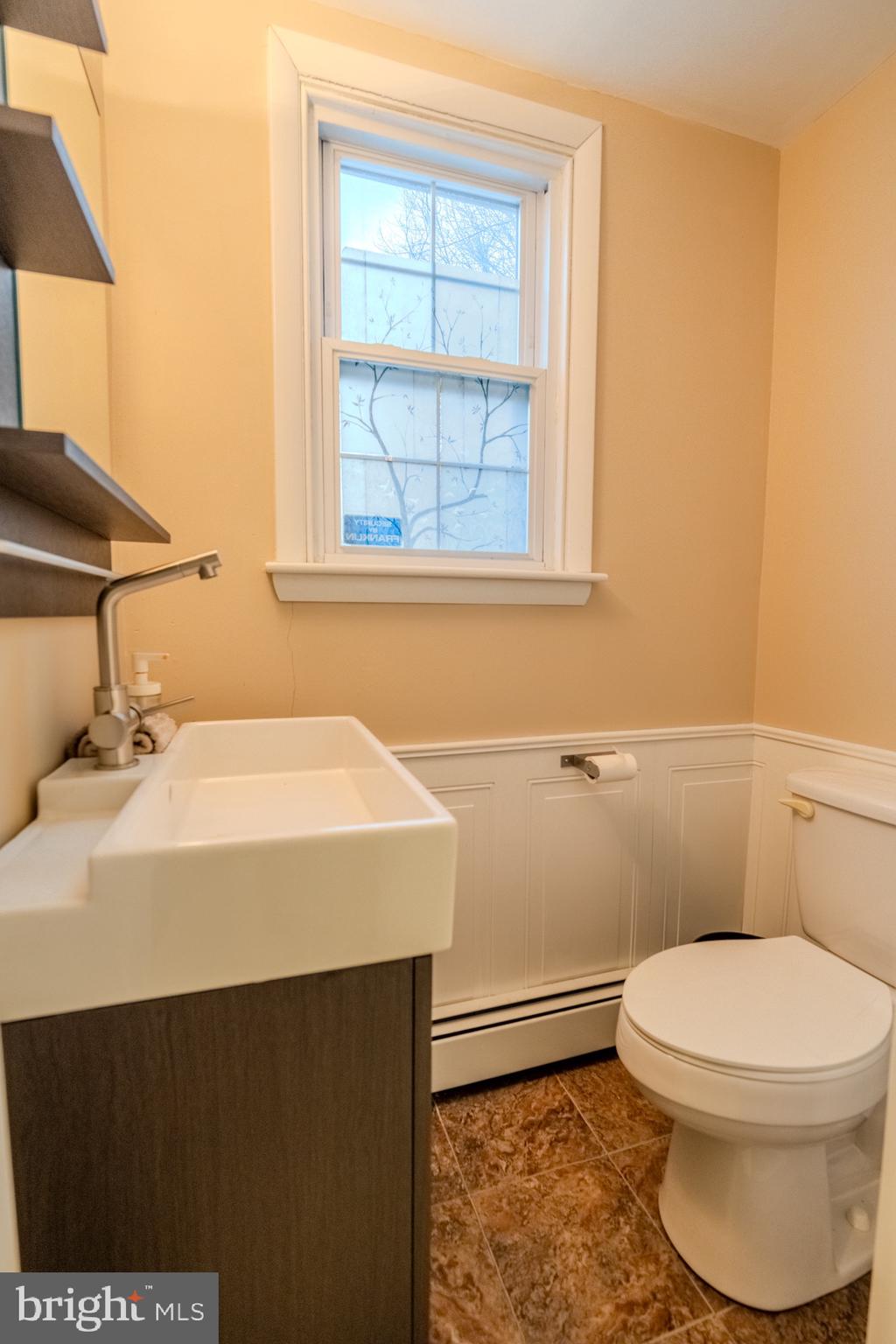 613 Seville Street Philadelphia, PA 19128 - Photo 21 of 37 a bathroom with a sink and a toilet