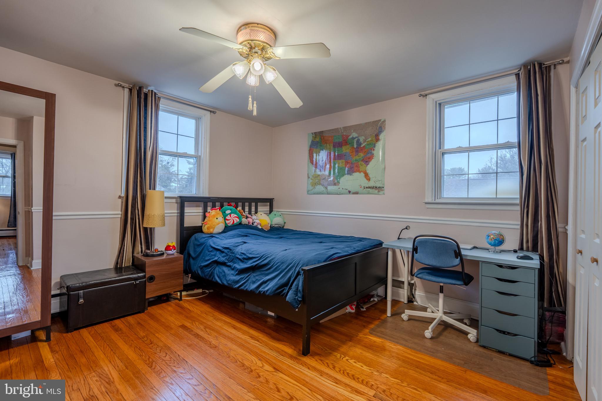 613 Seville Street Philadelphia, PA 19128 - Photo 25 of 37 a bedroom with furniture and a window