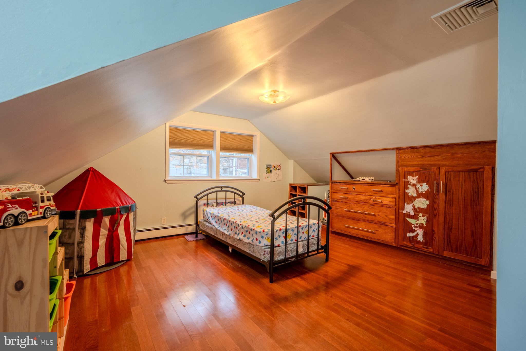 613 Seville Street Philadelphia, PA 19128 - Photo 28 of 37 a living room with furniture and wooden floor