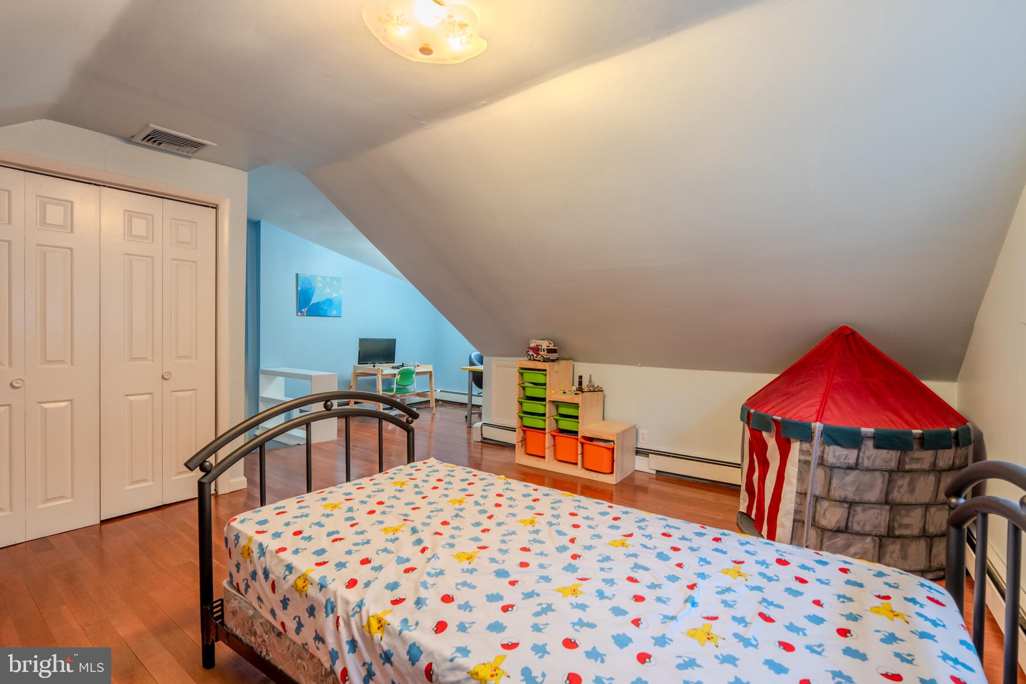 613 Seville Street Philadelphia, PA 19128 - Photo 29 of 37 a bedroom with a bed and a closet