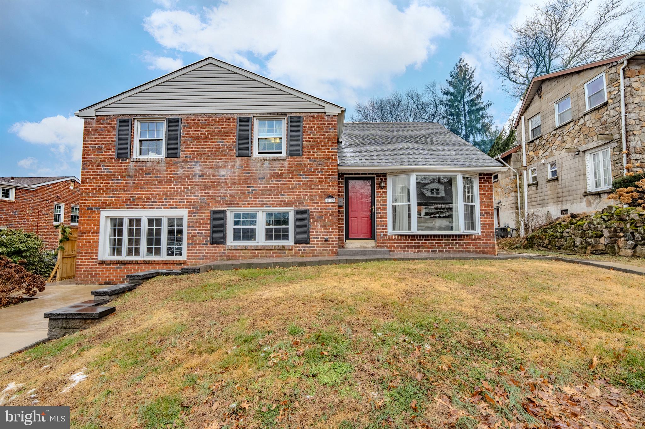 613 Seville Street Philadelphia, PA 19128 - Photo 3 of 37 a front view of a house with a yard
