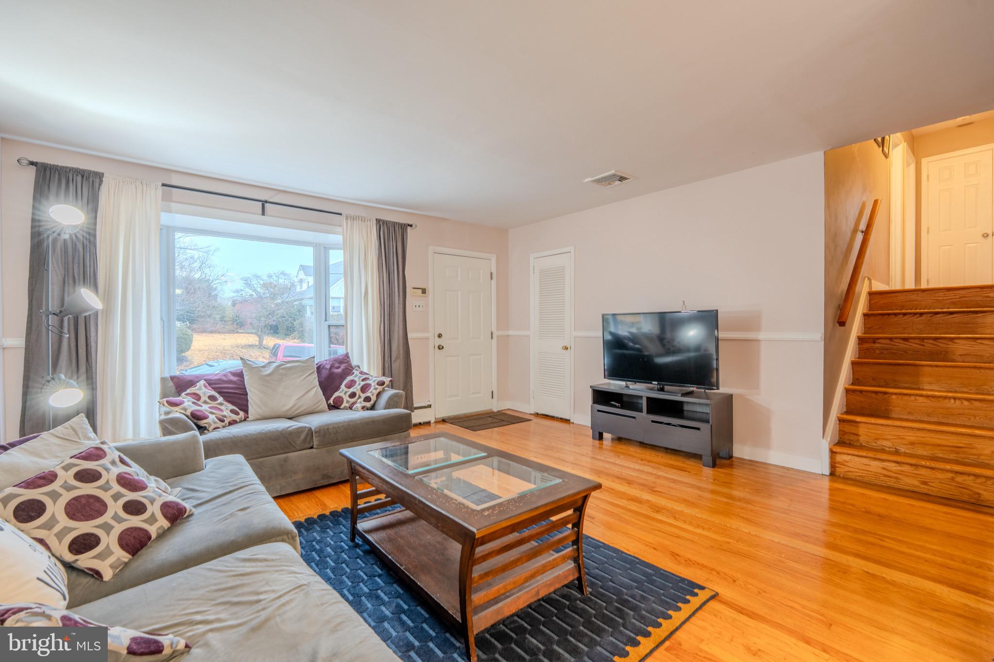 613 Seville Street Philadelphia, PA 19128 - Photo 6 of 37 a living room with furniture and a flat screen tv