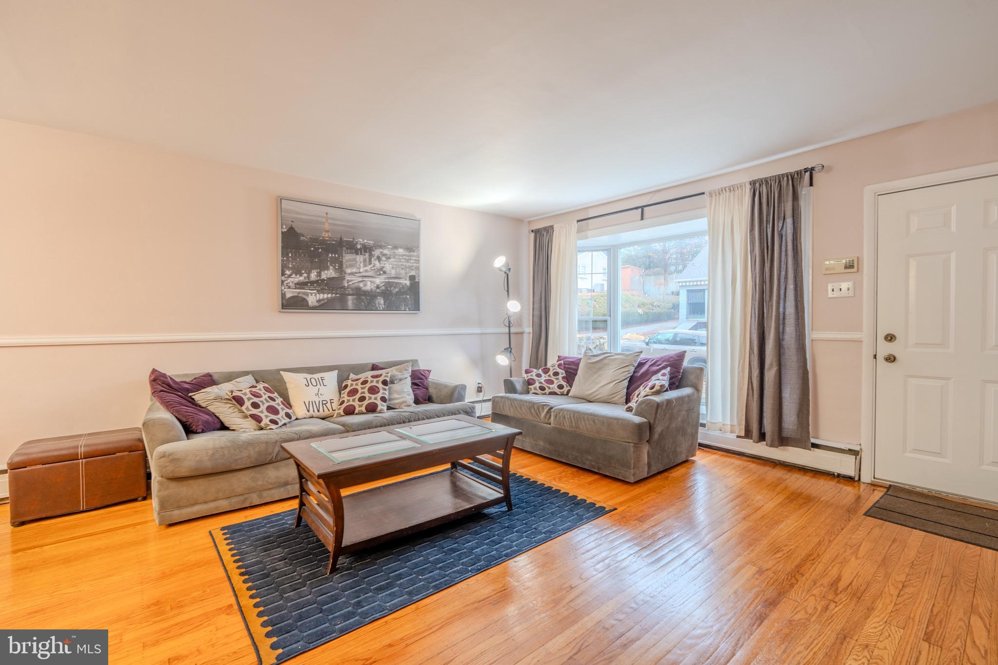 613 Seville Street Philadelphia, PA 19128 - Photo 7 of 37 a living room with furniture and a large window