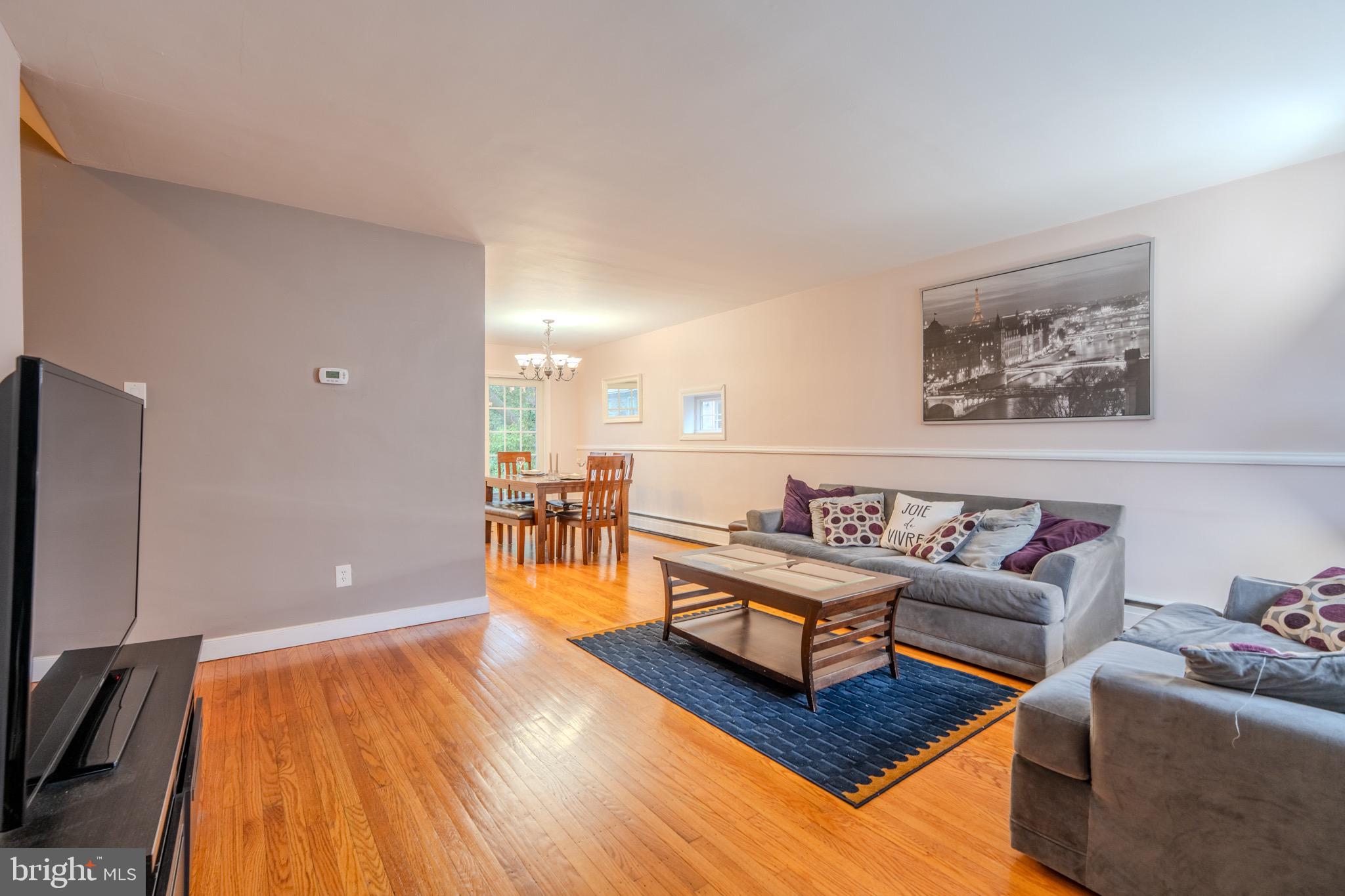 613 Seville Street Philadelphia, PA 19128 - Photo 8 of 37 a living room with furniture and wooden floor