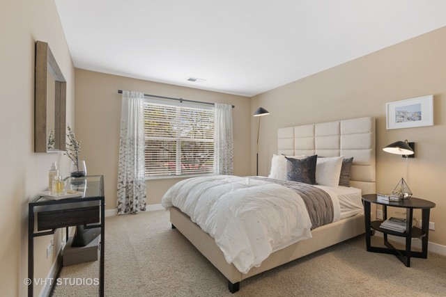20 Sterling Circle, Unit 103 Wheaton, IL 60189 - Photo 16 of 36 a bedroom with a bed and a window