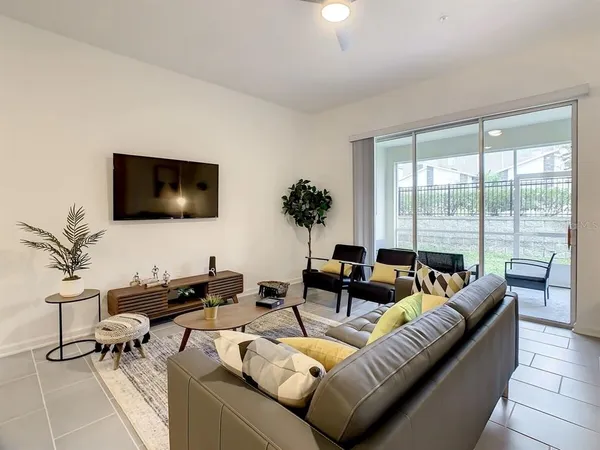 a living room with furniture and a flat screen tv