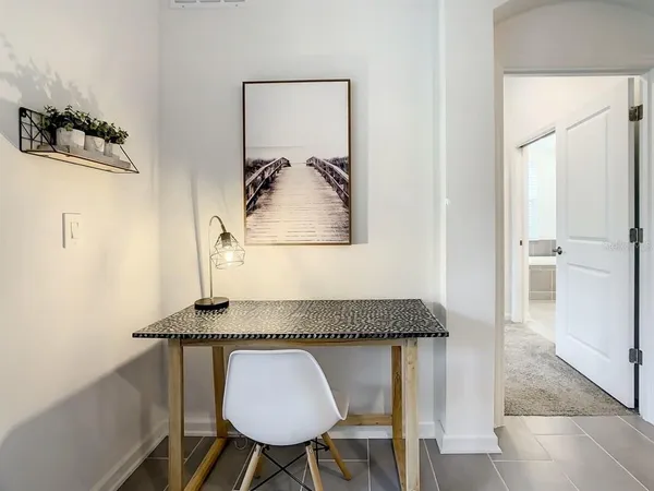 a living room with granite countertop furniture and a wooden floor
