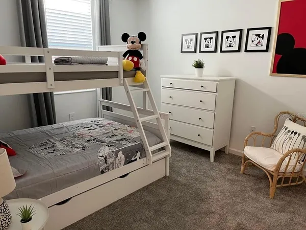 a bedroom with a bed and furniture