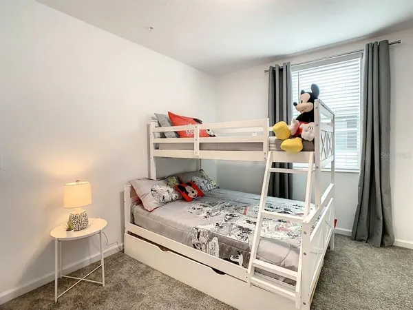 a bed room with a bed and a table