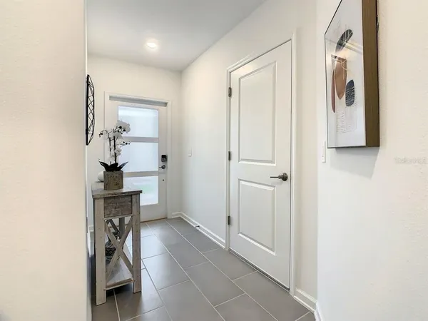 a bathroom with a shower sink vanity and toilet