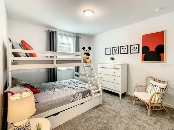 a bedroom with a bed and a dresser