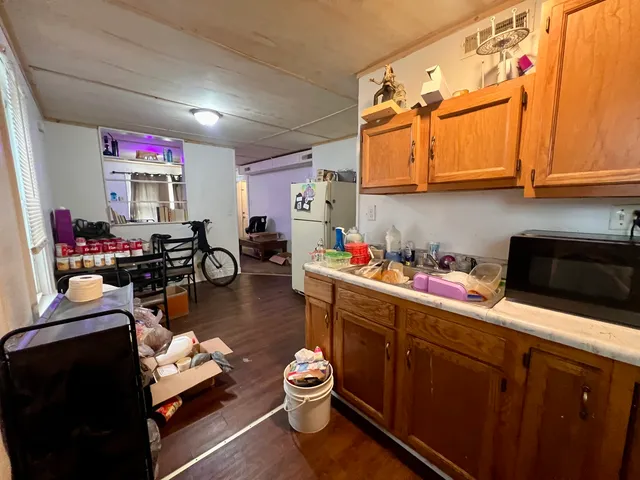 a kitchen with a lot of appliances and cabinets