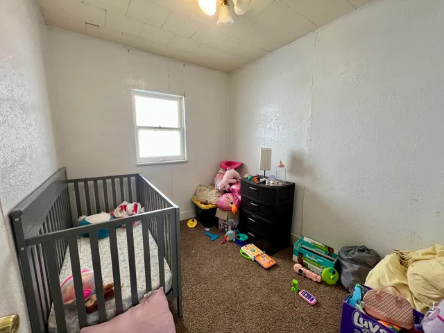 a view of hallway with furniture
