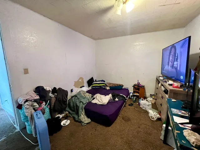 a view of a house with a yard and tree s