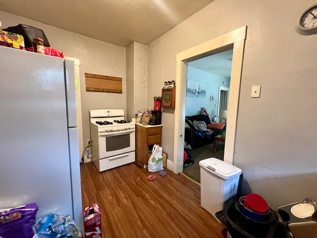 a white refrigerator freezer sitting inside of a kitchen