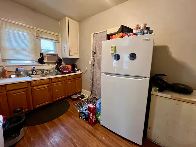 a room with furniture and wooden floor