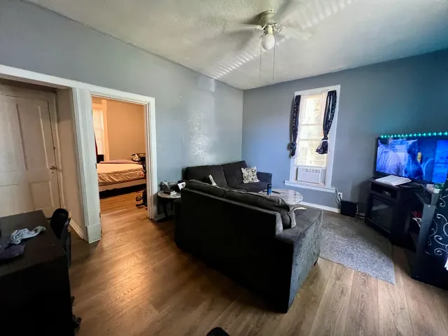 a view of a dining room with furniture and a kitchen