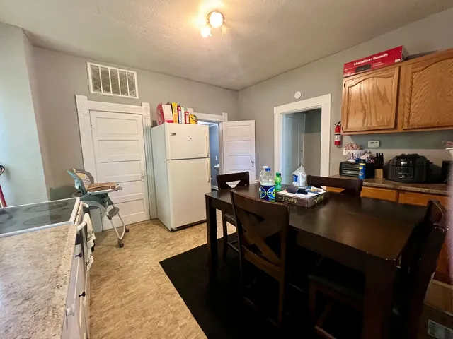 a bedroom with furniture and a flat screen tv
