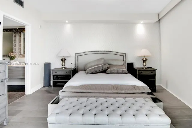 a bedroom with a bed and a table