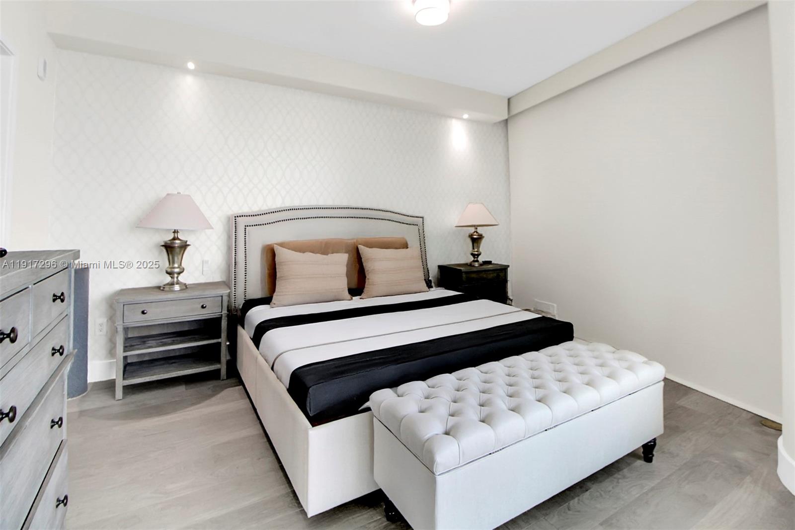 2900 Northeast 7th Avenue, Unit 1807 Miami, FL 33137 - Photo 12 of 36 a bedroom with a bed and lamp