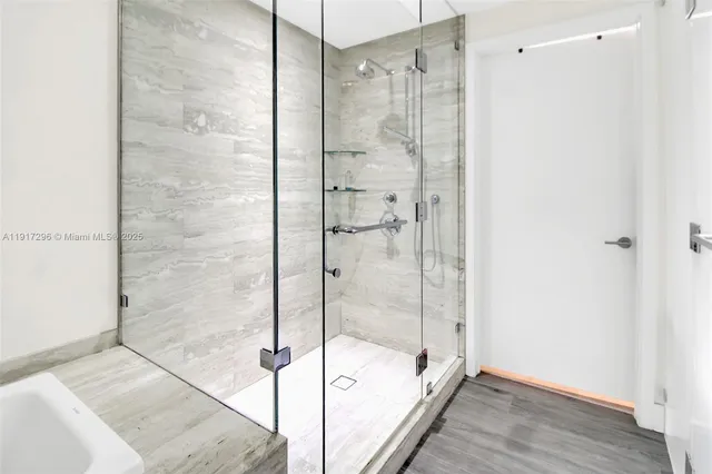 a bathroom with a shower and a bathtub
