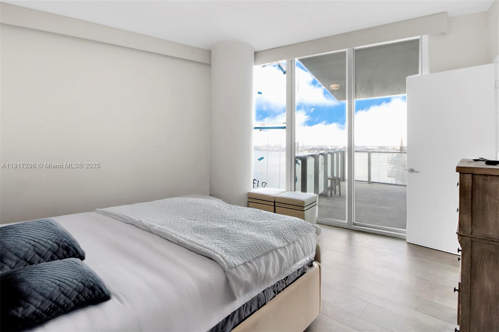 2900 Northeast 7th Avenue, Unit 1807 Miami, FL 33137 - Photo 18 of 36 a bedroom with a bed and a large window