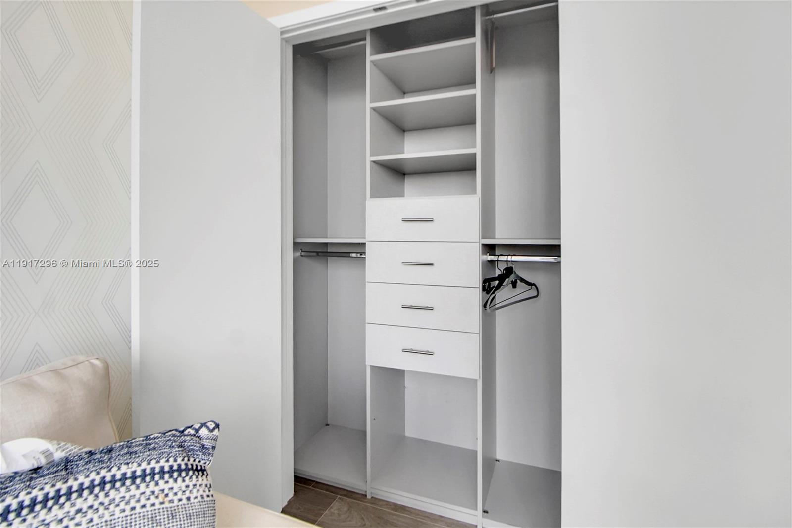 2900 Northeast 7th Avenue, Unit 1807 Miami, FL 33137 - Photo 23 of 36 a view of walk in closet with empty racks