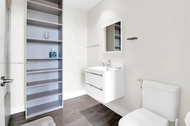 a white bath tub sitting next to a shower