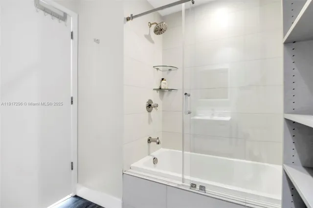 a view of a dining room with furniture and a chandelier