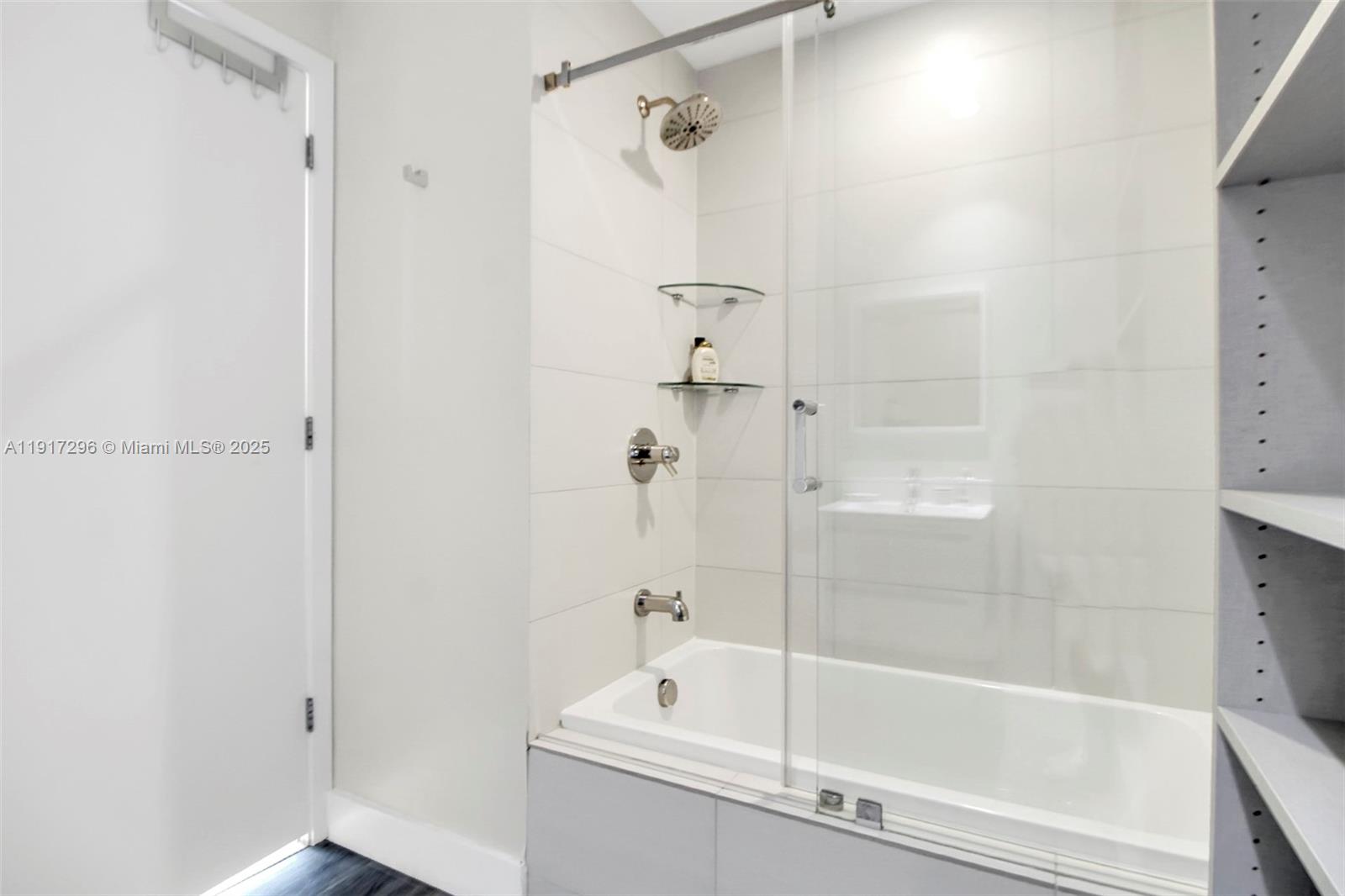 2900 Northeast 7th Avenue, Unit 1807 Miami, FL 33137 - Photo 25 of 36 a white bath tub sitting next to a shower