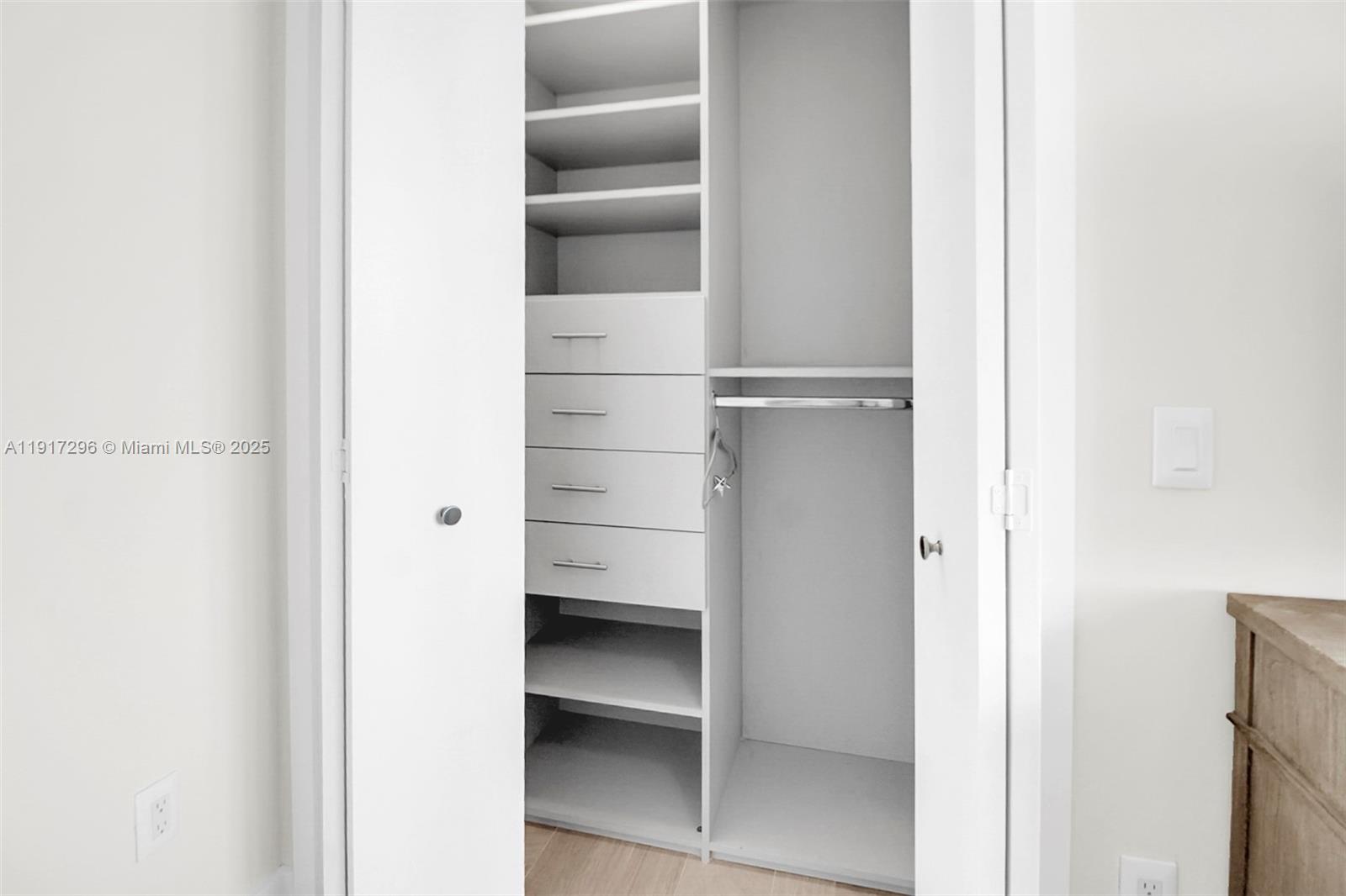 2900 Northeast 7th Avenue, Unit 1807 Miami, FL 33137 - Photo 28 of 36 a view of closet area with empty racks