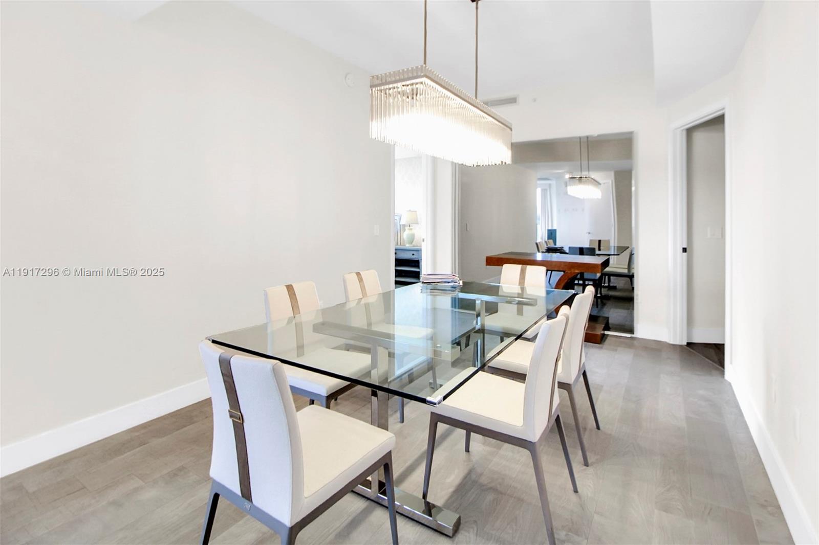 2900 Northeast 7th Avenue, Unit 1807 Miami, FL 33137 - Photo 34 of 36 a view of a dining room with furniture and wooden floor