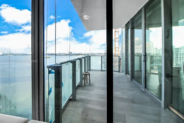 a view of a room with table and chairs