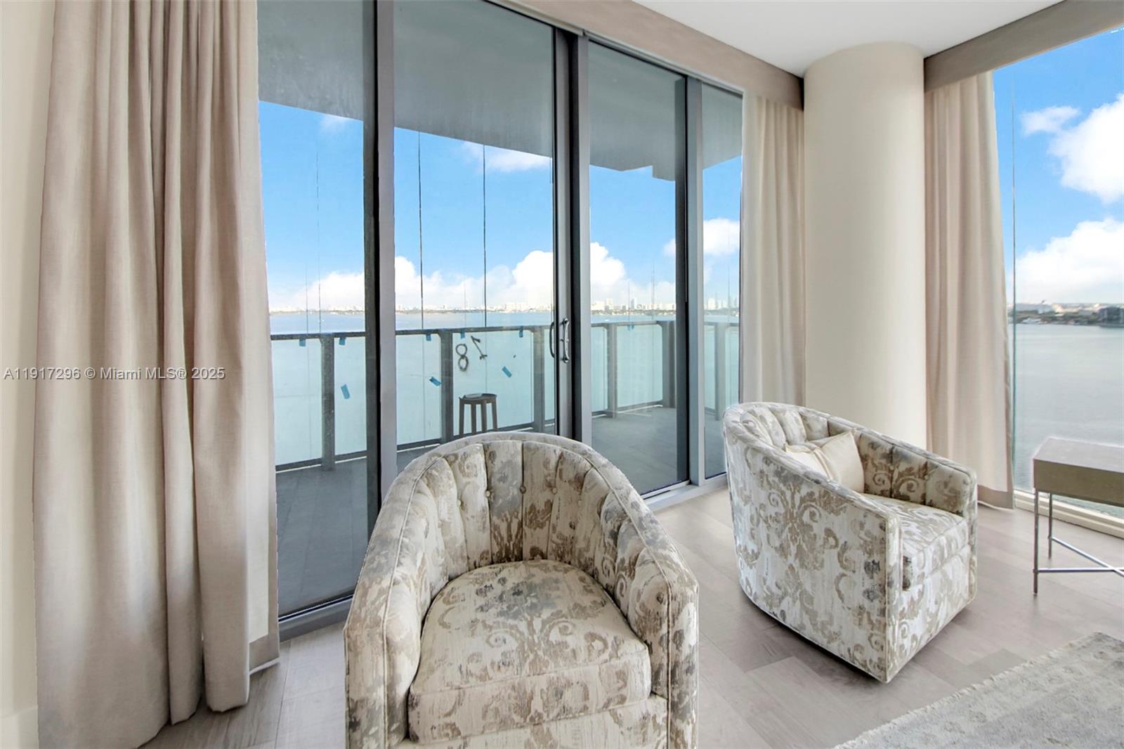 2900 Northeast 7th Avenue, Unit 1807 Miami, FL 33137 - Photo 6 of 36 a living room with furniture and large windows