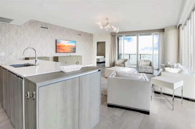 a view of living room with granite countertop furniture and a sink