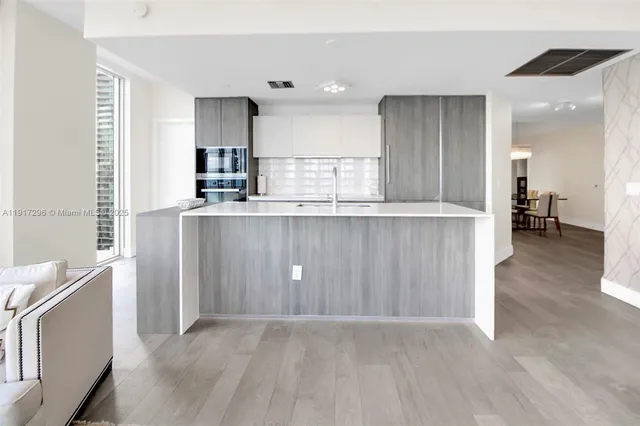a view of kitchen with wooden floor