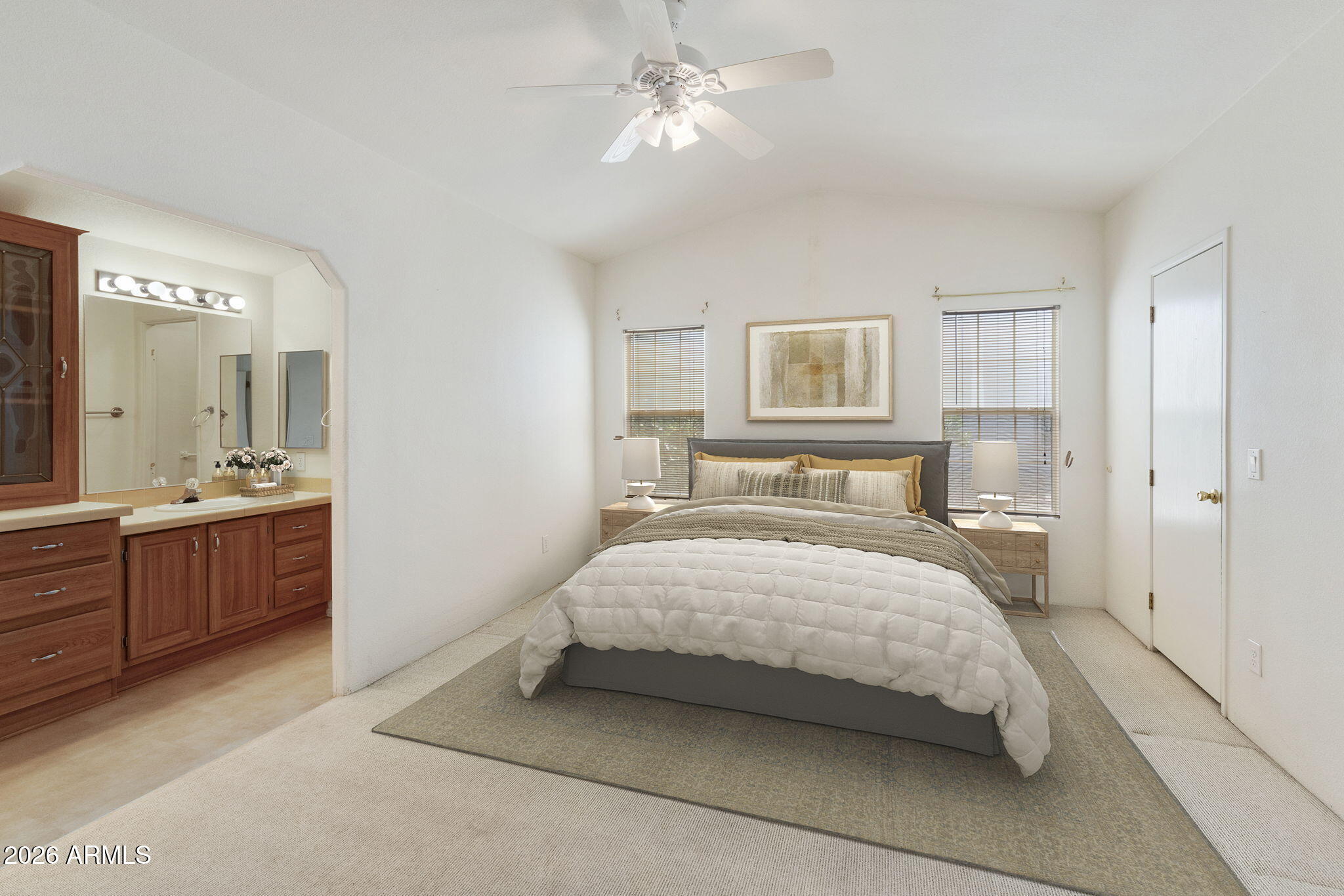 3700 South Tomahawk Road, Unit 73 Apache Junction, AZ 85119 - Photo 35 of 49 a bedroom with a large bed and a chandelier