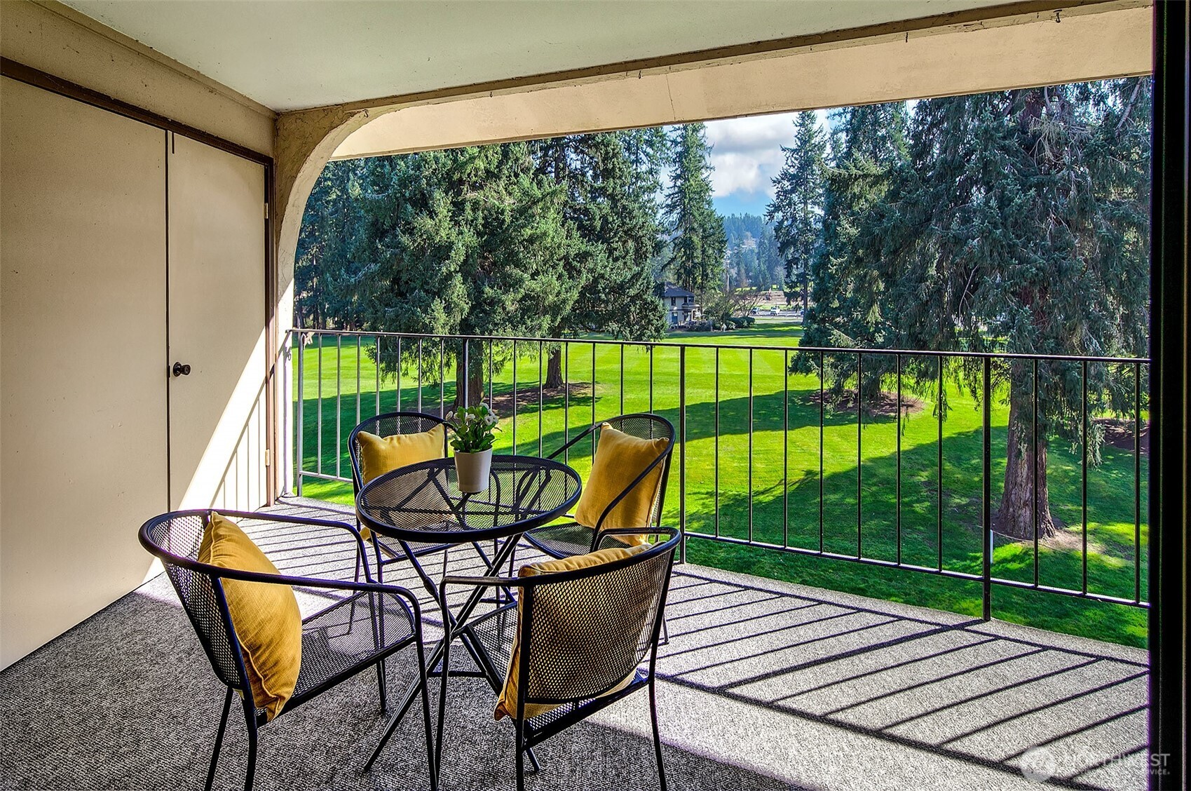 16929 Inglewood Road Northeast, Unit C305 Kenmore, WA 98028 - Photo 11 of 27 a view of a two chairs in the deck
