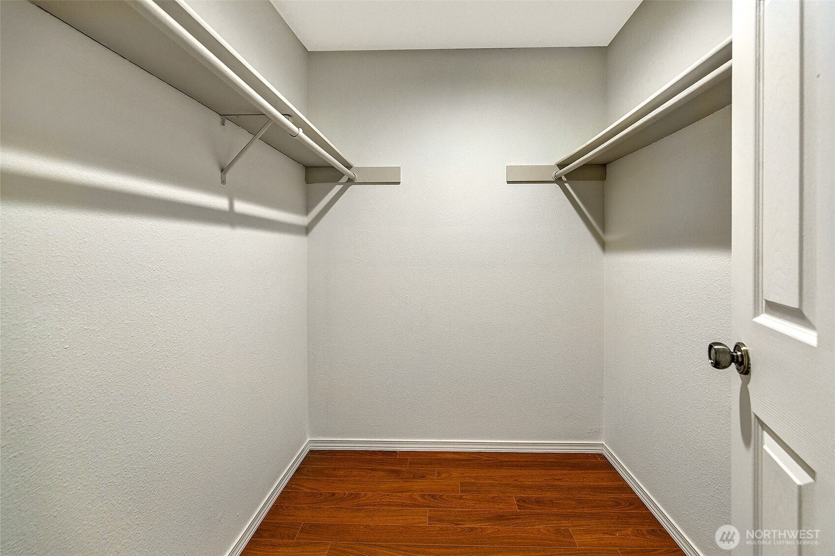 16929 Inglewood Road Northeast, Unit C305 Kenmore, WA 98028 - Photo 15 of 27 a view of a room with wooden floor and bench
