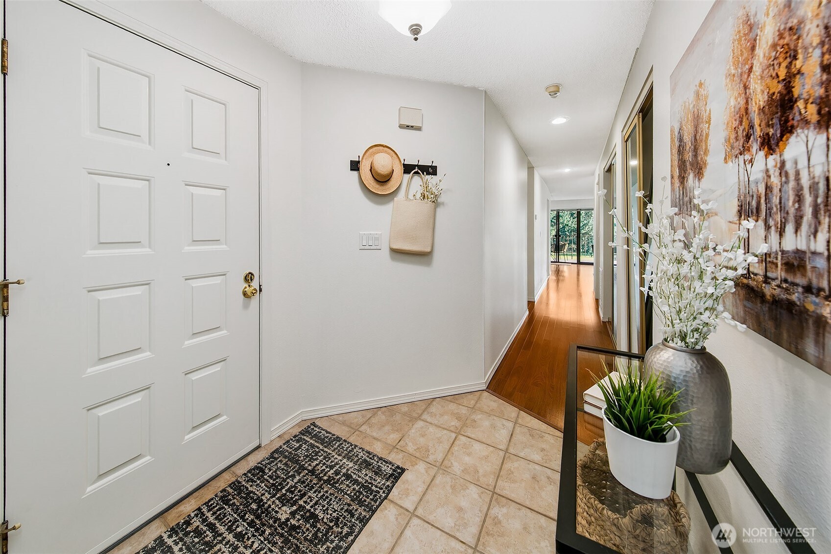 16929 Inglewood Road Northeast, Unit C305 Kenmore, WA 98028 - Photo 2 of 27 a view of a hallway and a couch