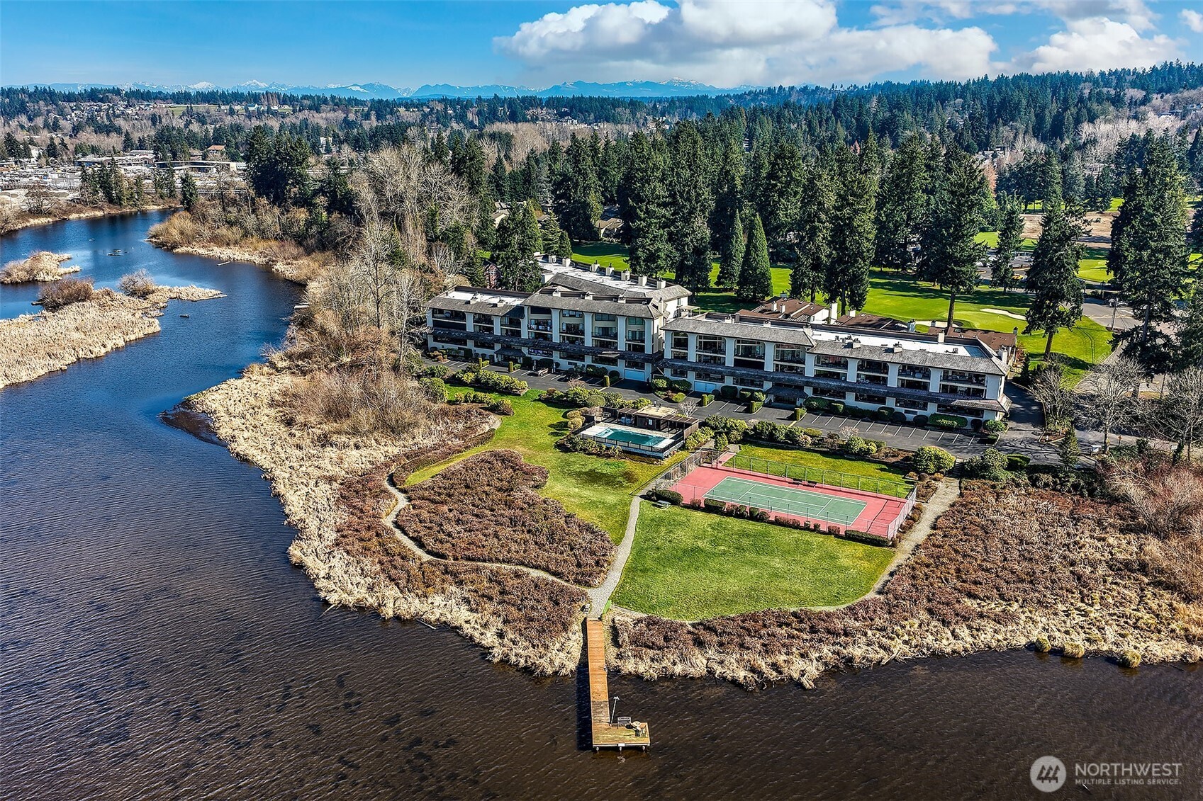 16929 Inglewood Road Northeast, Unit C305 Kenmore, WA 98028 - Photo 22 of 27 a view of a chairs and table in the patio