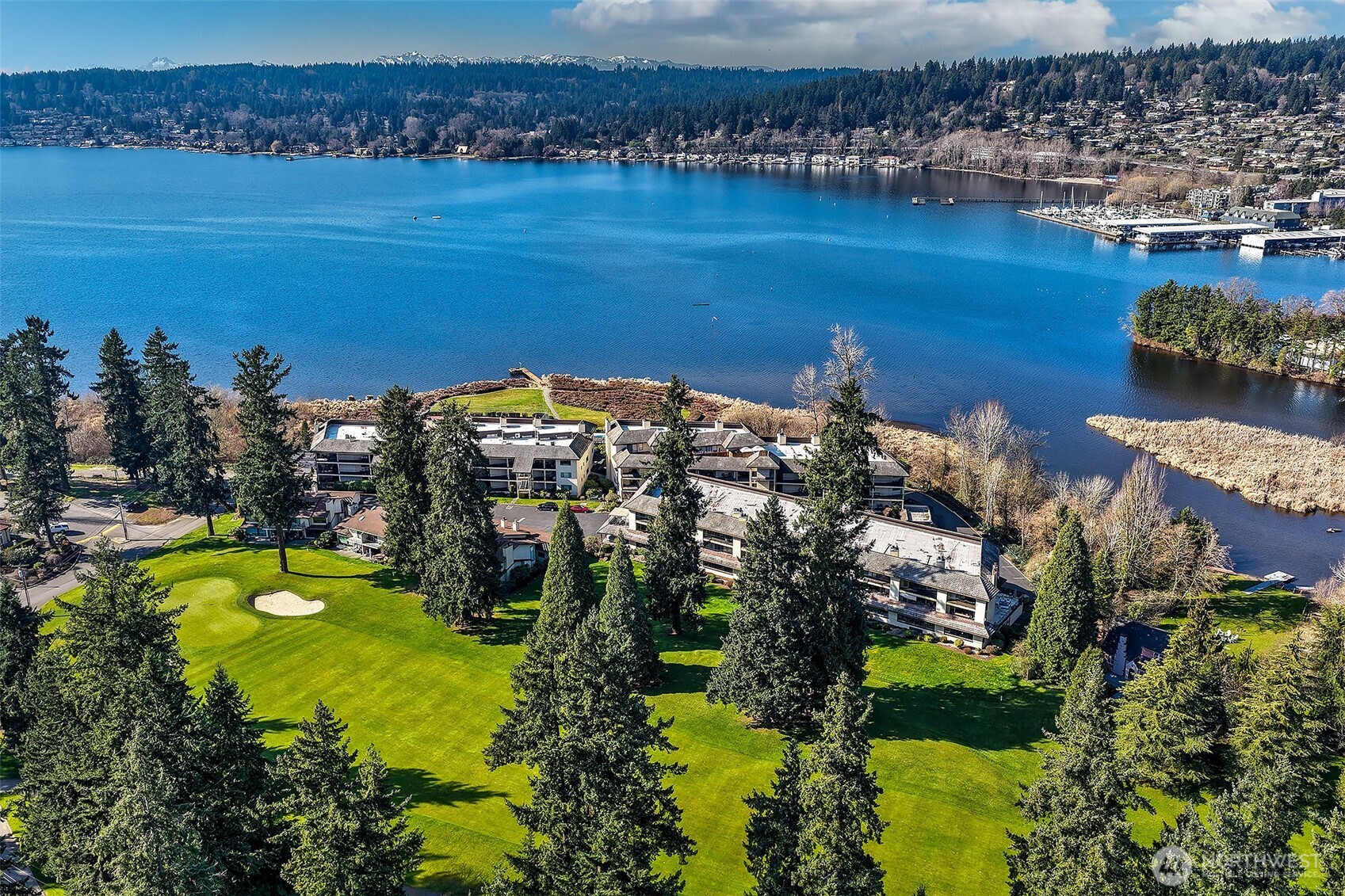 16929 Inglewood Road Northeast, Unit C305 Kenmore, WA 98028 - Photo 25 of 27 a view of a lake with boats and trees all around