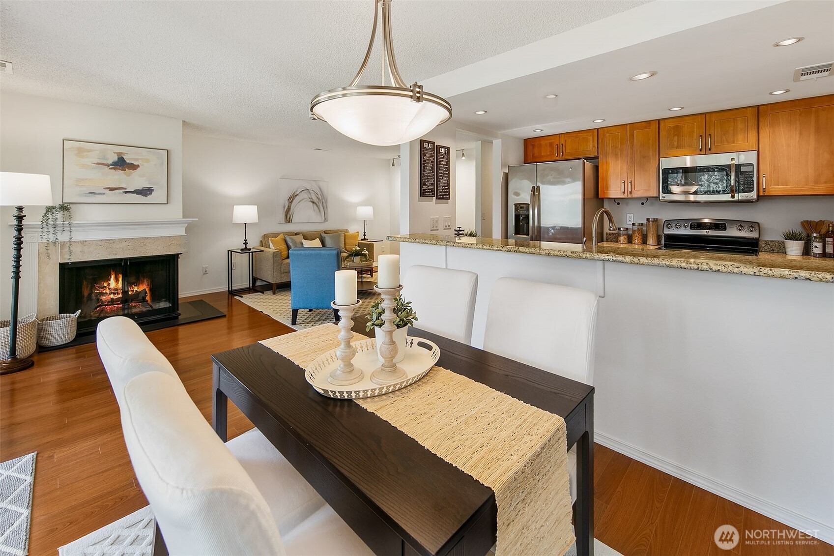 16929 Inglewood Road Northeast, Unit C305 Kenmore, WA 98028 - Photo 7 of 27 a view of a dining room with furniture window and wooden floor