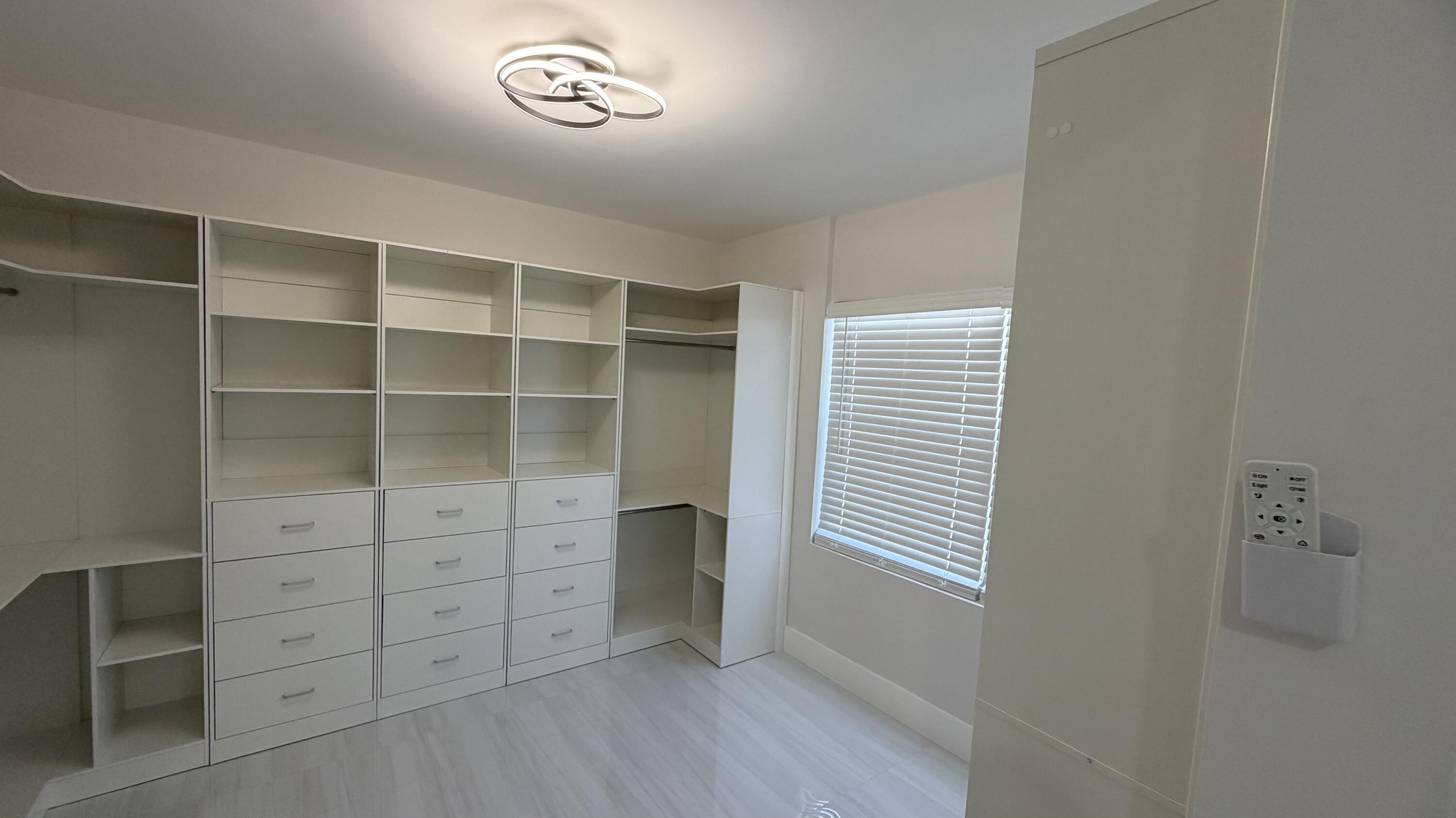 2521 Northeast 45th Street Lighthouse Point, FL 33064 - Photo 12 of 25 a view of an empty walk in closet