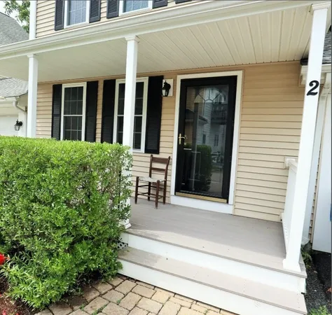 a view of house with outdoor space and porch