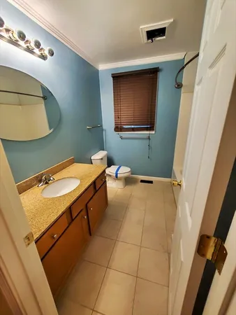 a bathroom with a toilet and a sink