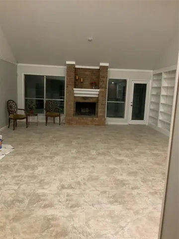 a view of a room with furniture and window